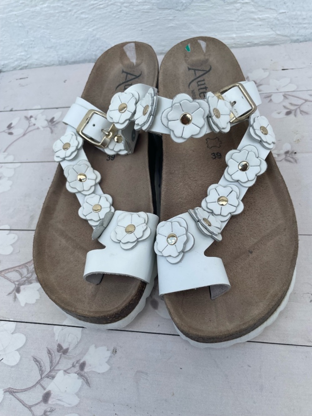 White Floral Leather Toe-Loop Sandals with Gold Accents